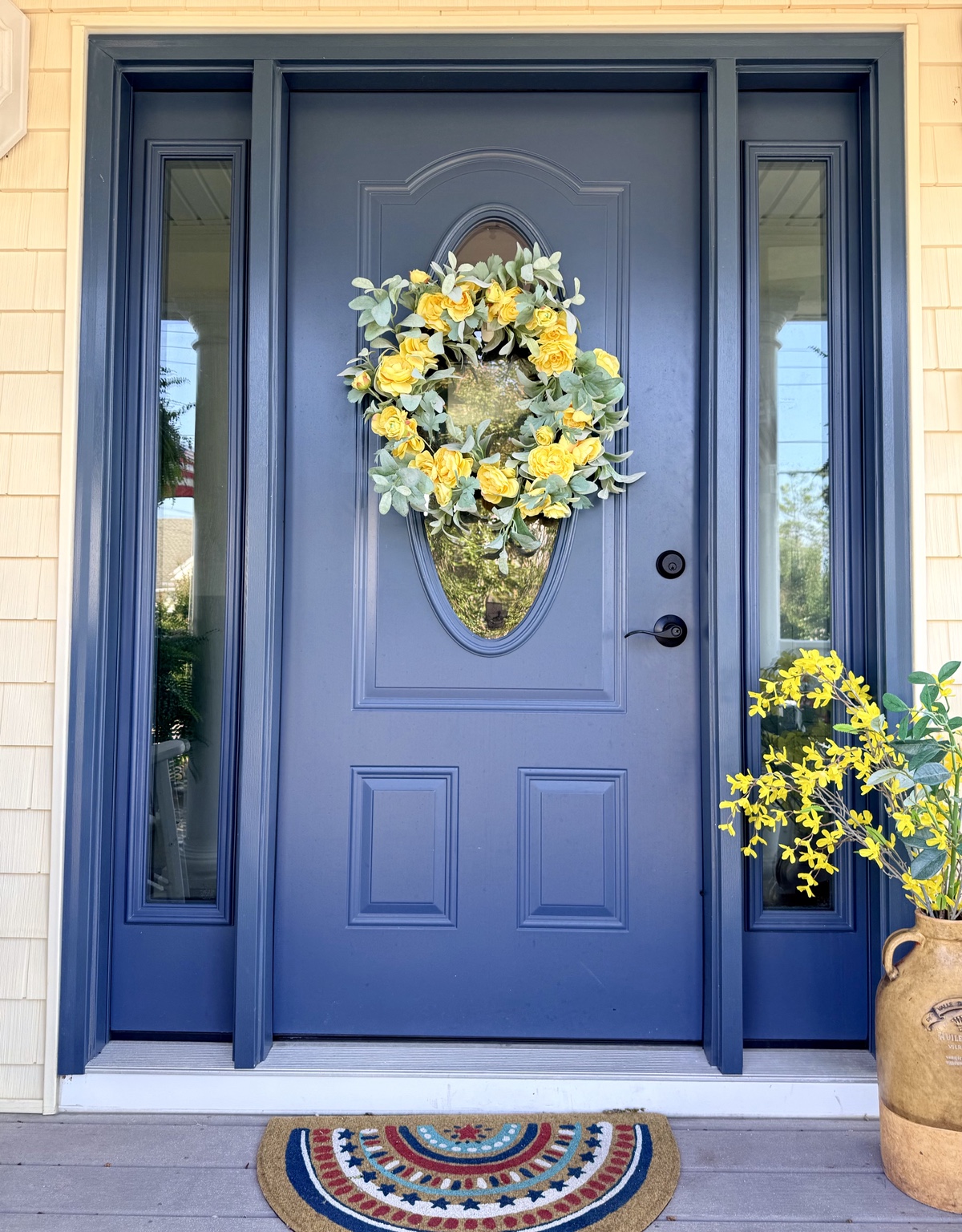 Blue front door with welcoming wreath